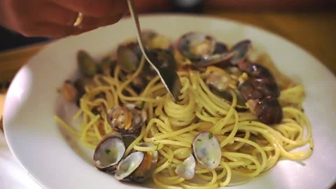Unrecognisable person using silver fork for eating delicious traditional Italian 스톡 동영상 158742768
