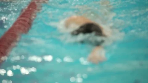Unrecognizable athlete swims crawl front view Stock Footage 84950309