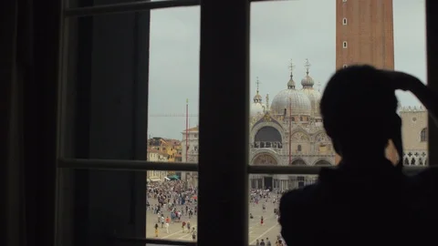 Unrecognizable athletic looking out of window. Handsome young guy enjoying St. Video stock 112432626