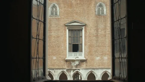 Unrecognizable athletic looking out of window. Handsome young guy enjoying Stock Footage 112435480
