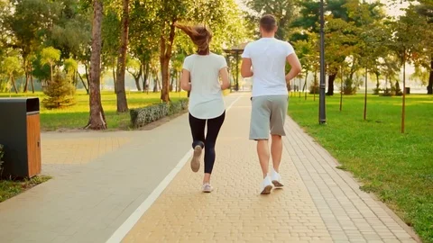 Unrecognizable athletic people exercising together Stock Footage 104825690