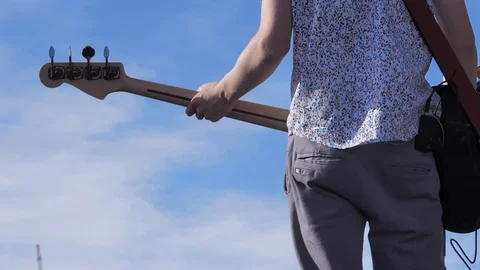 Unrecognizable back of guitar player Stock Footage 99179933