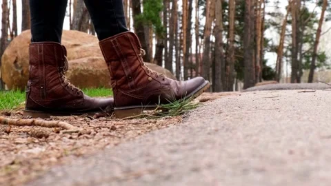 Unrecognizable bad person throws plastic bottle into the grass in the forest Stock Footage 154723352