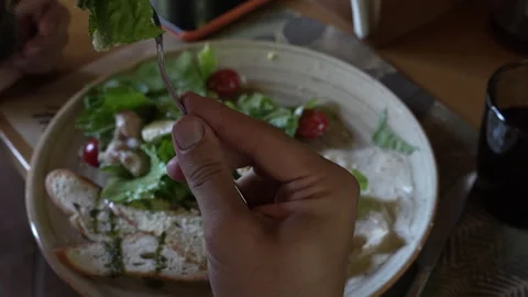 Unrecognizable bearded man eats fresh vegetable salad Stock Footage 248543182