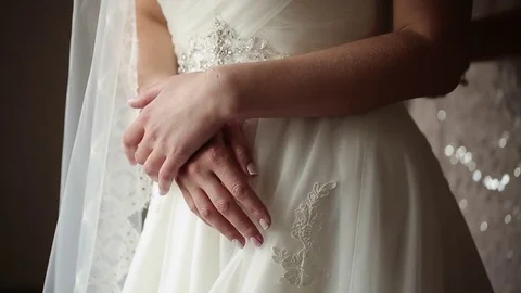 Unrecognizable bride staying near window Stock Footage 72987220