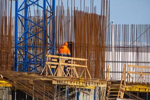 Unrecognizable builder on construction site Stock Photos