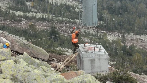 Unrecognizable builders in orange vests Stock Footage 114940547
