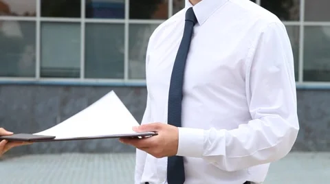 Unrecognizable businessman signing a document Stock Footage 54287177