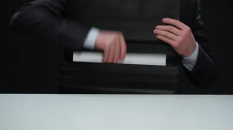 Unrecognizable businessman taking documents out of his briefcase Stock Footage 25643126