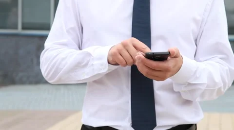 Unrecognizable businessman using a mobile phone Stock Footage 54287411