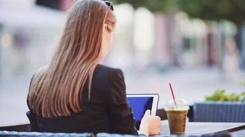 Unrecognizable Businesswoman using Digital Tablet in outdoor Cafe. SLOW MOTION. Stock Footage