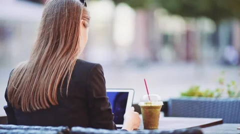 Unrecognizable Businesswoman using Digital Tablet in outdoor Cafe. SLOW MOTION. Stock Footage 67847735