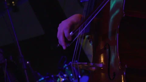 Unrecognizable cellist playing on stage, close-up Stock Footage 146953112