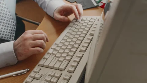 Unrecognizable Clerical Worker Typing on Old Keyboard in Retro Computer Stock Footage 280259485