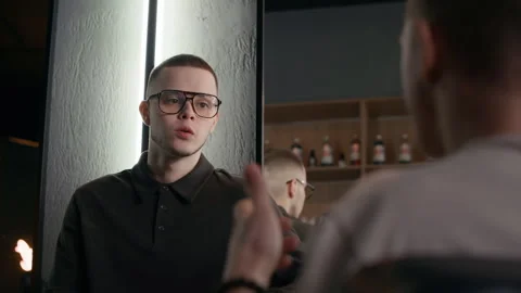 Unrecognizable Client Having Conversation with Barber Stock Footage 330412587