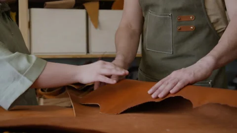 Unrecognizable Craftsman and his Apprentice Touching Genuine Lather at Workshop Video stock 301676730