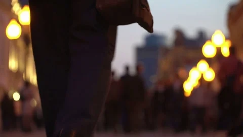 Unrecognizable crowd of people walking around night city in light of street Video stock 83521142