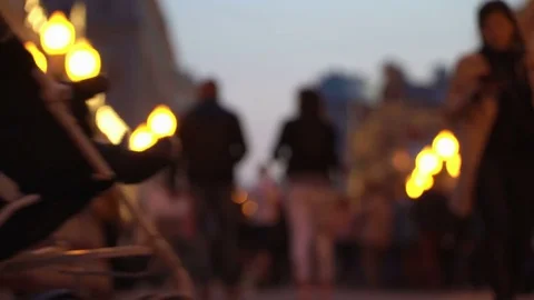 Unrecognizable crowd of people walking around night city in light of street Stock-Footage 83974114