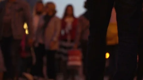 Unrecognizable crowd of people walking around night city in light of street Stock-Footage 84235519