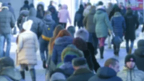 Unrecognizable Crowd of People in Warm Winter Clothes Walking Along Icy Street Stock Footage