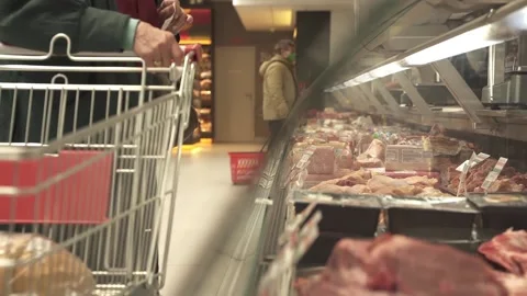 Unrecognizable customer is standing in front of the meat counter Stock Footage 152516648