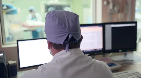Unrecognizable doctor controls operation... | Stock Video | Pond5