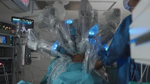 Unrecognizable doctor controls process of automatically performing surgery Stock Footage 245620150