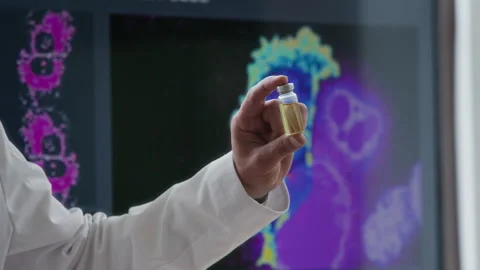 Unrecognizable Doctor Demonstrating Vial with Targeted Therapy Medication Stock Footage 317513747