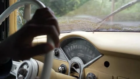 Unrecognizable driver hands on steering wheel. driving vehicle in the outside in Stock-Footage 336265584