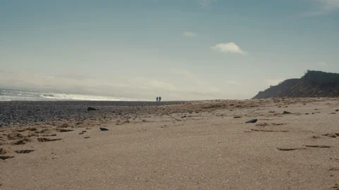 Unrecognizable elderly couple having a walk on a coast of Atlantic Ocean Stock Footage 97684855