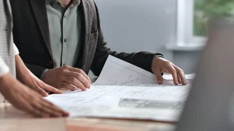 Unrecognizable engineer coworkers plan blueprint architect project brainstorming Stock-Footage 228713994