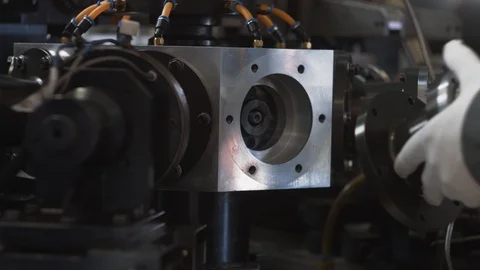 Unrecognizable engineer repairs modern production machine, machinery shop indoor Stock Footage 93340831
