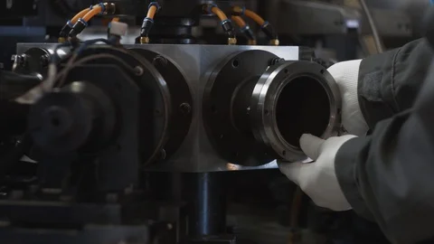 Unrecognizable engineer repairs modern production machine, machinery shop indoor Stock Footage 93340963