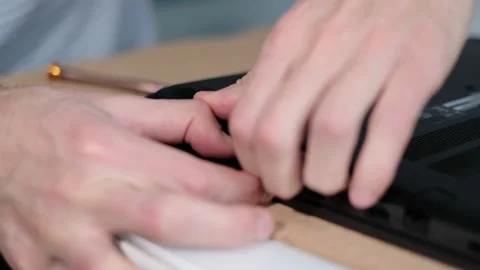 Unrecognizable engineer separating computer from case. Electronic renovation Stock Footage 166145501