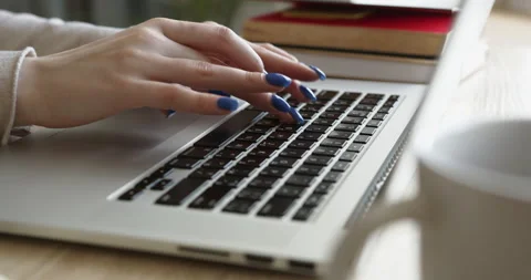 Unrecognizable female hands typing something on laptop keyboard. Stock Footage 145718224