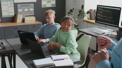 Unrecognizable Female Teacher Teaching Programming Lesson to Students 스톡 동영상 317984196