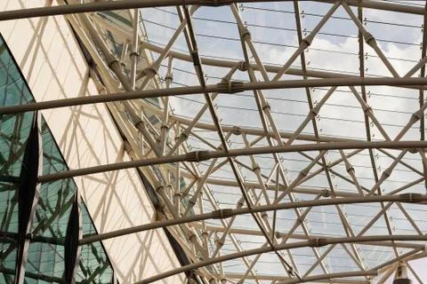 Unrecognizable fragment of modular structural glass ceiling against sky. Stock Photos