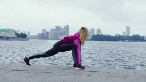 Unrecognizable girl doing warm-up before training at street Video stock 196286353