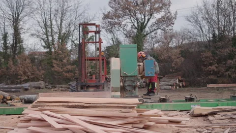An unrecognizable guy on a wood chopping machine Stock Footage 271165063