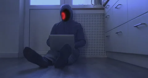 Unrecognizable hacker finishes work at computer sitting on floor. Binary red Stock Footage 238007550