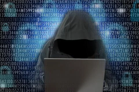 Unrecognizable hacker in front of computer – cybercrime concept Stock Photos