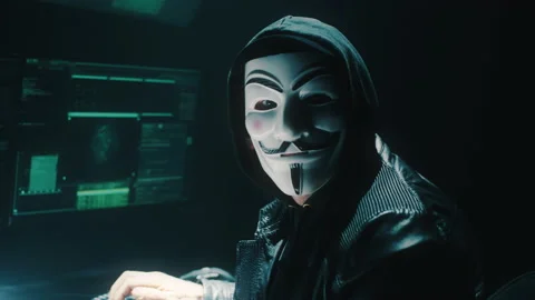 Unrecognizable hacker looking at camera Stock Footage 170227794