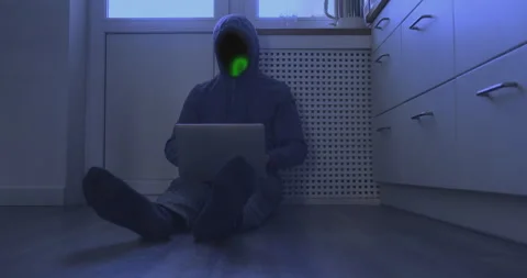 Unrecognizable hacker work at computer sitting on floor. Binary green glowing Stock Footage 239018507