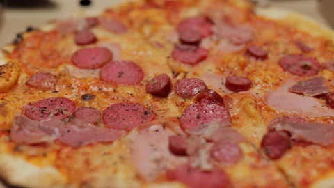 Unrecognizable hand opening delivery box with hot delicious pizza inside. Food Stock Footage 194547635