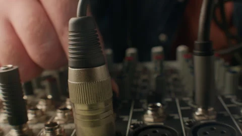 Unrecognizable Hand Twisting Mixing Console Knobs 스톡 동영상 294709728