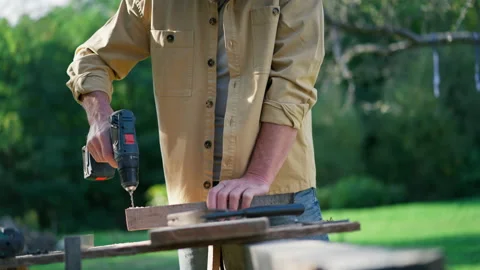 Unrecognizable handyman carpenter working in carpentry diy workshop outdoors Stock Footage 182941006