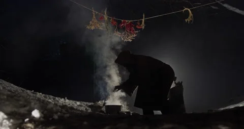 Unrecognizable hermit brewing potion in cave Video stock 168807037