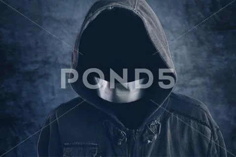 Unrecognizable hooded hooligan with mouth duct taped Stock Photos
