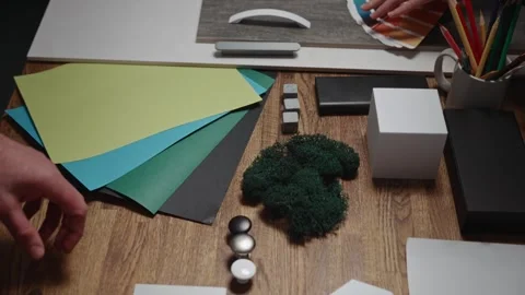 Unrecognizable interior designers select materials and color schemes for a Stock Footage 269958896