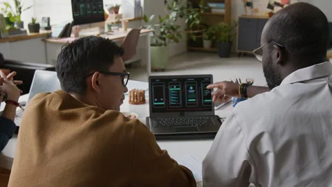 Unrecognizable IT Specialists Discussing New Smartphone App Stock Footage 317343836